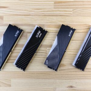 Four computer ram sticks on a wooden surface
