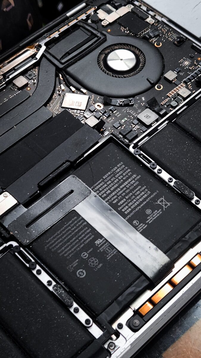 Close-up of laptop internal components and battery
